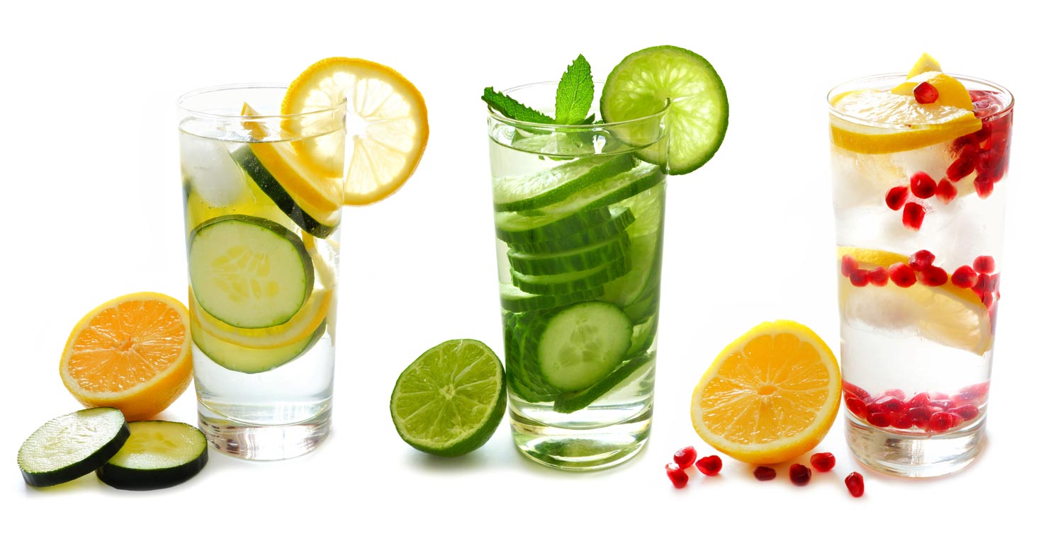 three glasses of water with different fruit in them